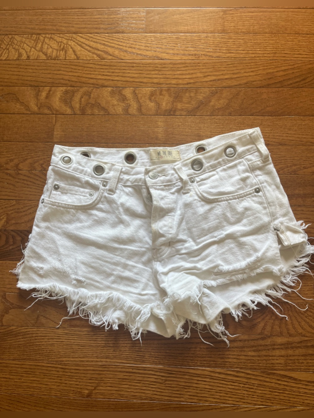 Free People White Distressed Denim Shorts with Grommet Waist